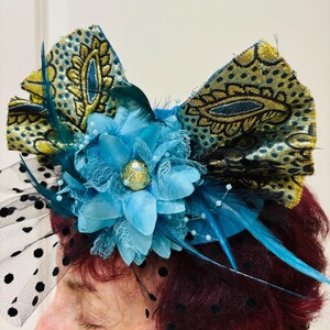 Green teal, purple flowers on a gold woven base fascinator Garden Symphony Feather Fascinator Hat in Lavender Turquoise  main image 4
