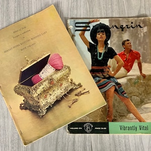 May include: Two vintage magazines are displayed. One features a gold jewelry box with pink yarn, and the text "BERNAT SUPER KNITTING WORSTED YARNS." The other magazine has a woman in a black outfit and the text "Vibrantly Vital."