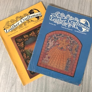 May include: Two copies of The Leather Craftsman magazine. The September/October 1967 issue features a painting of a forest scene with a deer. The November/December 1967 issue features a stained glass window with a star and angels.