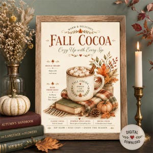 Può includere: Una stampa da parete incorniciata con il testo FALL COCOA e Cozy Up with Every Sip. L'illustrazione mostra una tazza piena di marshmallow, una coperta a quadri, un libro e foglie autunnali. La stampa include dettagli come Rich & Creamy, Made Fresh Daily e descrizioni di gusti come Classic Cocoa, Pumpkin Spice e Mocha.