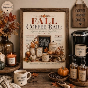 May include: A framed wall art print titled FALL COFFEE BAR with text listing coffee favourites and ingredients. The illustration features pumpkins, coffee mugs, and autumn leaves in warm tones. A circular badge in the corner reads COMES UNFRAMED.