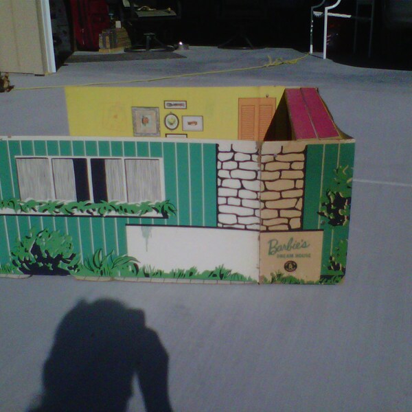 1960 Barbie Dream house with moveable  cardboard furniture.