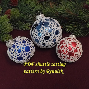 May include: Three Christmas ornaments covered in white lace tatting. The ornaments are blue, red, and blue. The text "PDF shuttle tatting pattern by Renulek" is at the bottom of the image.