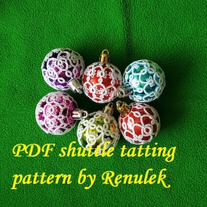 May include: Six white crocheted Christmas ornaments with different colored centers on a green background. The text "PDF shuttle tatting pattern by Renulek" is below the ornaments.
