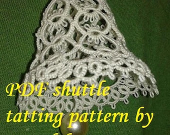 May include: White crocheted bell with a pearl bead at the bottom. The bell is a shuttle tatting pattern by Renulek. PDF shuttle tatting pattern by Renulek.