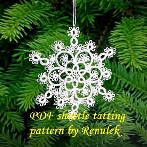 May include: White snowflake made with shuttle tatting, hanging from a string against a green evergreen background. The text "PDF shuttle tatting pattern by Renulek" is at the bottom of the image.