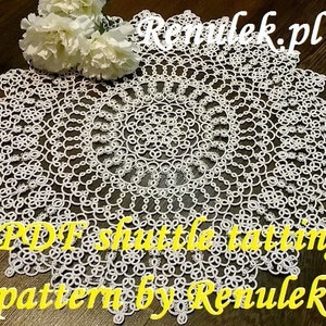 May include: White, circular, shuttle tatting doily with a detailed floral design. The doily has a scalloped edge and is made of delicate, woven thread. Text on the image reads "PDF shuttle tatting pattern by Renulek.pl".