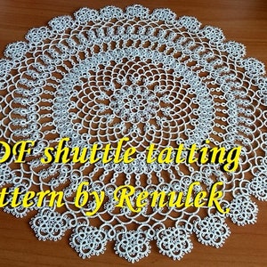 May include: White crochet doily with a circular design. The doily is made with a shuttle tatting technique. The text "PDF shuttle tatting pattern by Renulek" is visible in the image.