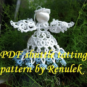 May include: White crocheted angel ornament with blue accents, resting on a bed of green foliage. The text "PDF shuttle tatting pattern by Renulek" is visible below the ornament.