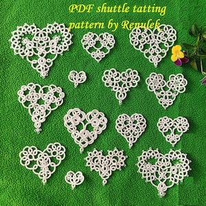 May include: White shuttle tatting heart patterns on a green background. The image includes various sizes of delicate, lacy heart shapes. Text at the top reads "PDF shuttle tatting pattern by Renulek."