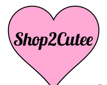 May include: Pink heart-shaped logo with the text "Shop2Cutee" in black.