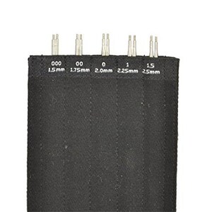 May include: A set of six interchangeable knitting needles in a black fabric case. The needles are labeled with sizes 000 (1.5 mm), 00 (1.75 mm), 0 (2.0 mm), 1 (2.25 mm), and 1.5 (2.5 mm).