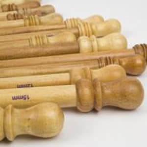 May include: A set of wooden knitting needles with a variety of sizes, ranging from 1.5mm to 3.5mm. The needles have a smooth, natural finish and are ideal for knitting projects.