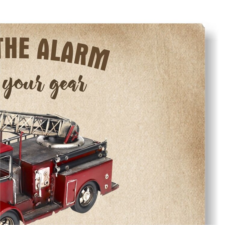 May include: A vintage-style red and black fire truck model with a ladder, set against a tan background. The text "THE ALARM your gear" is printed in brown. The model has detailed features like wheels and a ladder.