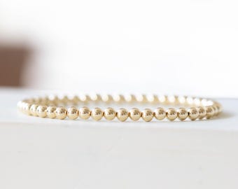Pulsera elástica con cuentas de oro laminado de 4 mm: amarilla o rosa