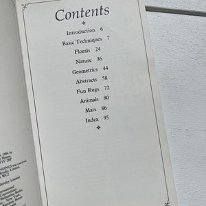 May include: A book titled "Contents" with a table of contents listing different rug designs, including florals, nature, geometrics, abstracts, fun rugs, animals, and mats. The book includes an introduction and index.