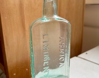 Antique Arinca Liniment Bottle: Blue Apothecary Glass, 1800s Collectible