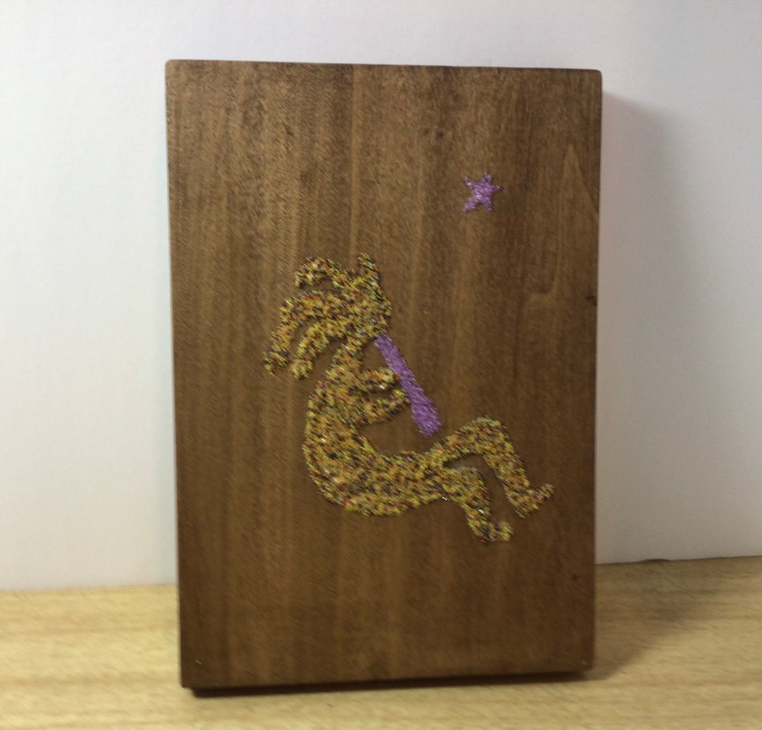 Kokopelli sand painting, wood with hanging hardware, sparkling goldish Kokopelli on brown wood, home decor, dorm room, southwest US symbol
