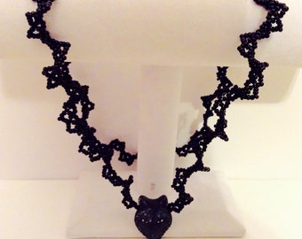 handmade black wolf face necklace, wildlife accessory, lacy wolf necklace, Oglala butterfly stitch, wolf face jewelry, black ruffled jewelry