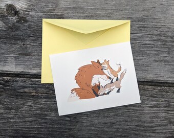 Fox and cubs greeting card with envelope. Illustration by KOUZZA.