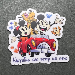 May include: A white sticker with a red car, Mickey Mouse, Minnie Mouse, and Pluto. The car has yellow headlights and a white license plate. The characters are smiling and waving. The text "Nothing can stop us now" is written in purple below the car.