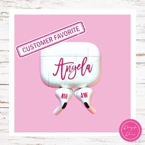 May include: A white wireless earbud charging case and two earbuds featuring the name Angela in hot pink script. The earbuds are marked with the initials AW in hot pink. A rectangular banner at the top displays the text CUSTOMER FAVORITE.