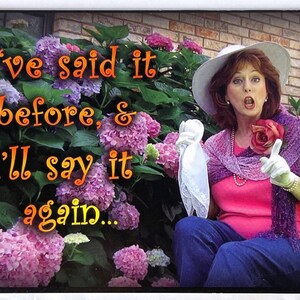 May include: A woman wearing a white hat, pink shirt, purple shawl, and white gloves is sitting in front of a bush of pink hydrangeas. She is holding a white handkerchief and pointing with her right hand. The text "I've said it before, & I'll say it again..." is written in orange on the image.