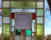 Stained Glass window with an old fFrank Lloyd Wright glass tile  light green border