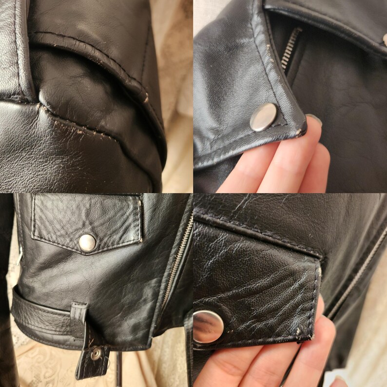 Op de afbeelding: Close-up opnamen van een zwarte leren jas, met details zoals de zak, rits en drukknoopsluitingen. De jas heeft een klassieke bikerstijl met een reverskraag en een riemdetail in de taille. Het leer lijkt licht versleten.