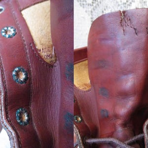 May include: Close-up of a worn, reddish-brown leather boot. The boot features decorative metal eyelets and a distressed appearance. The interior shows a tan lining and a label with text.