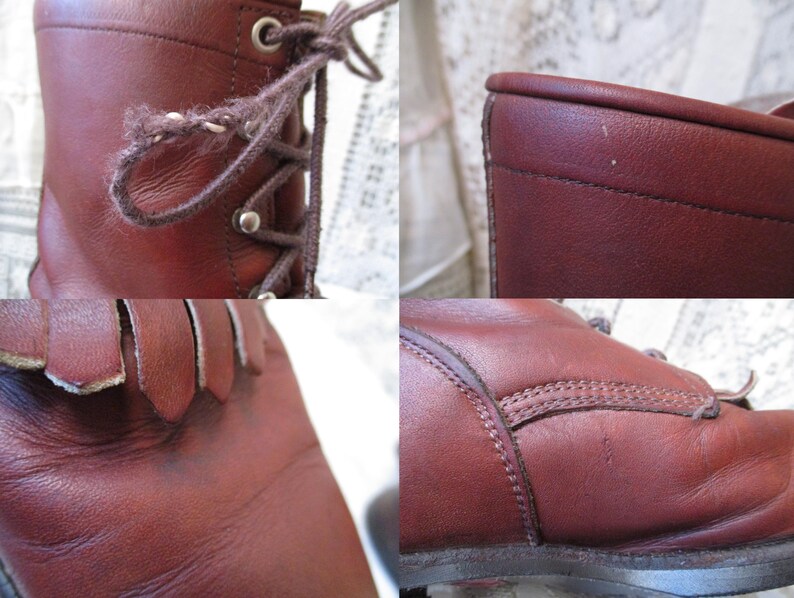 May include: Close-up of a pair of brown leather boots. The boots have laces, metal eyelets, and a fringe detail at the top of the foot. The leather appears worn, with visible stitching and a textured surface.