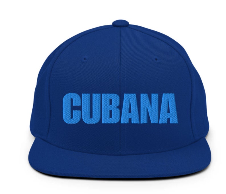 May include: A blue baseball cap with the word 'CUBANA' embroidered in light blue on the front.
