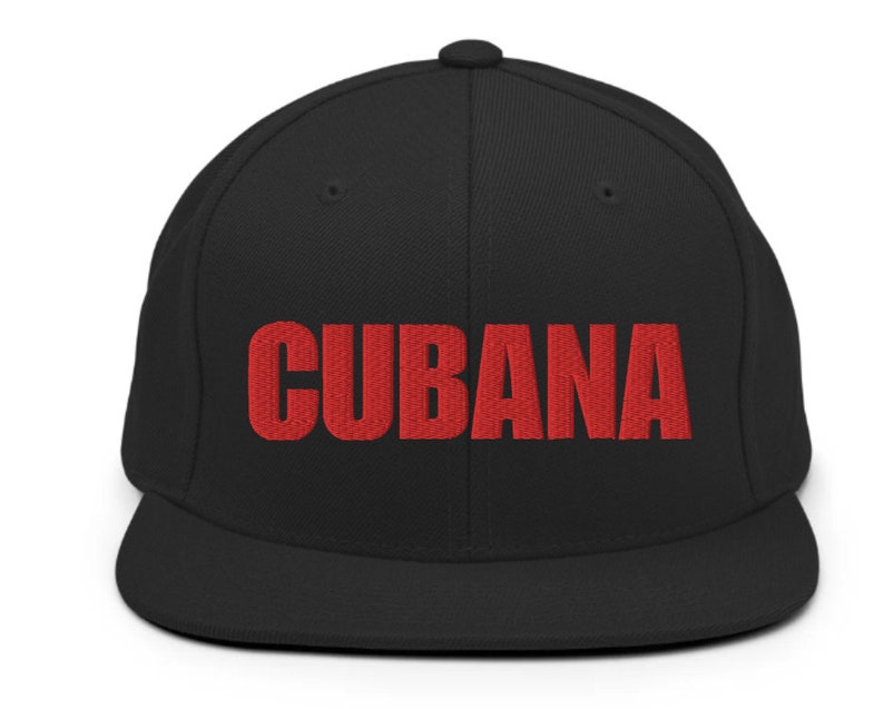 May include: A black and red baseball cap with the word 'CUBANA' embroidered in red on the front.