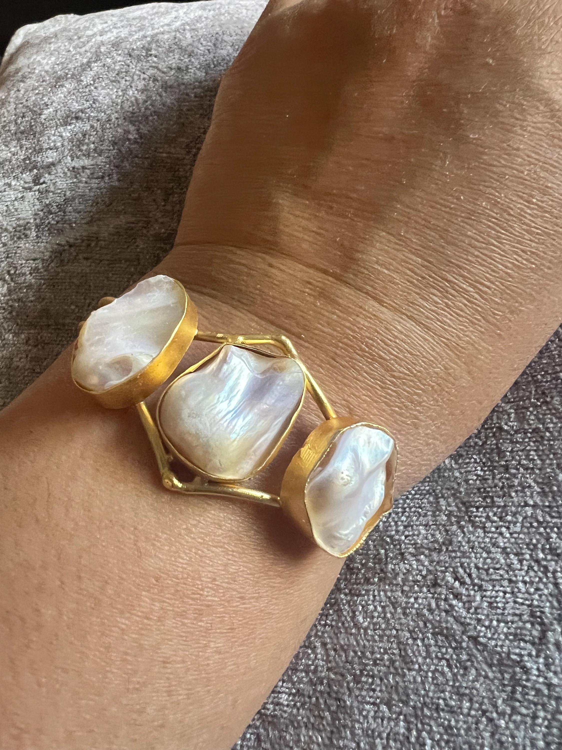 Cuff bracelet, mother of pearl gemstone on gold base
