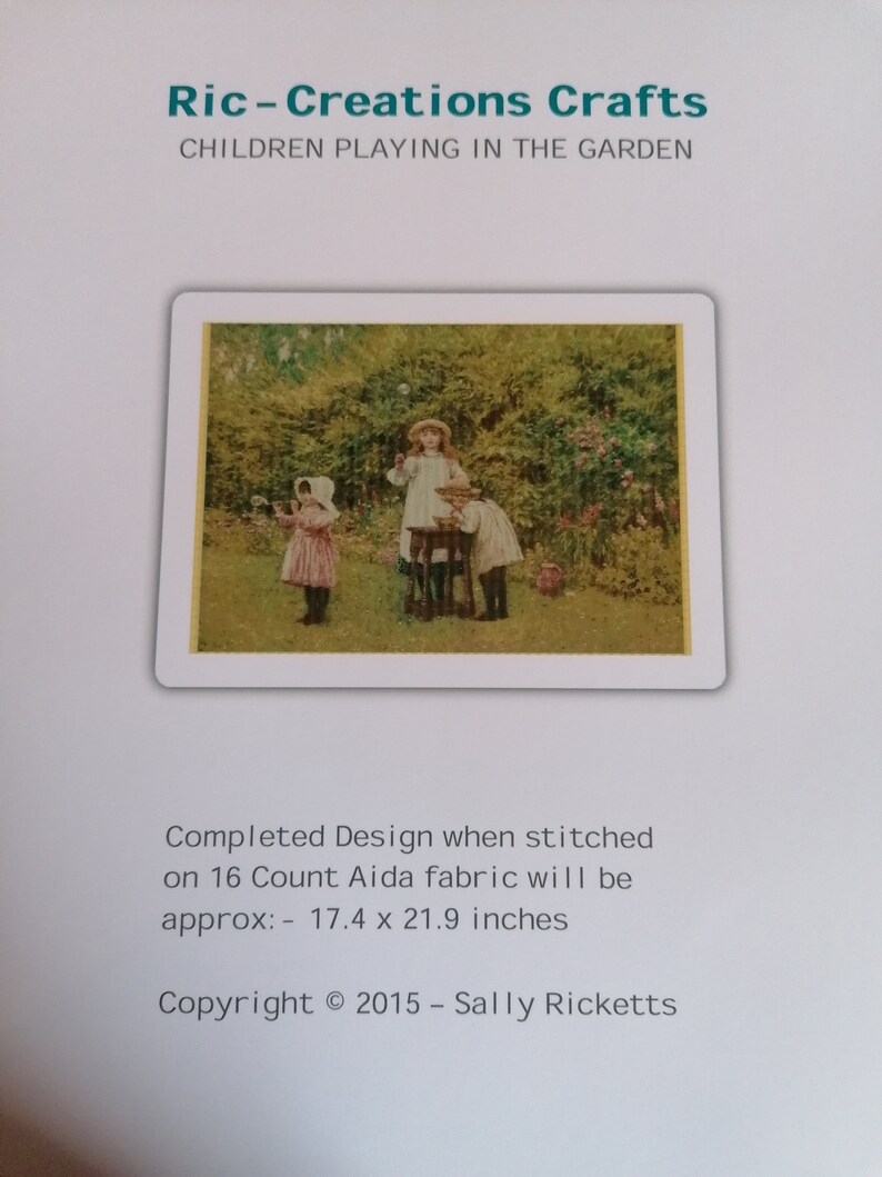May include: A cross-stitch pattern titled Ric-Creations Crafts Children Playing in the Garden. The image shows three children in a garden. Text states the completed design on 16 count Aida fabric is approximately 17.4 x 21.9 inches. Copyright 2015.
