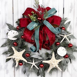 Coastal Christmas Mixed Greenery On Pine Wreath with Large Starfish, Sand Dollars, Red Ball Ornaments & Beautiful Velvet Bow.