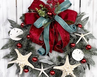 Coastal Christmas Mixed Greenery On Pine Wreath with Large Starfish, Sand Dollars, Red Ball Ornaments & Beautiful Velvet Bow.