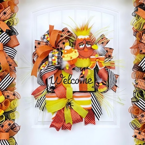 May include: A rustic wooden sign with the text "Welcome to our home" in white lettering. The sign features a distressed finish and a simple, inviting design, perfect for entryway decor.