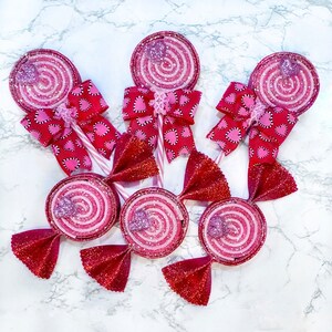 Red and pink foam valentine lollipops and candy, hand painted with glitter.
