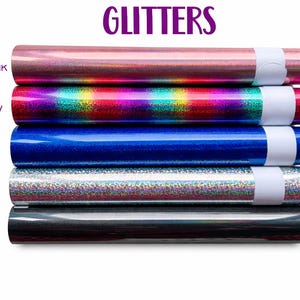 A collection of six different colored glitter rolls, each with a unique color and pattern, arranged in a stack.