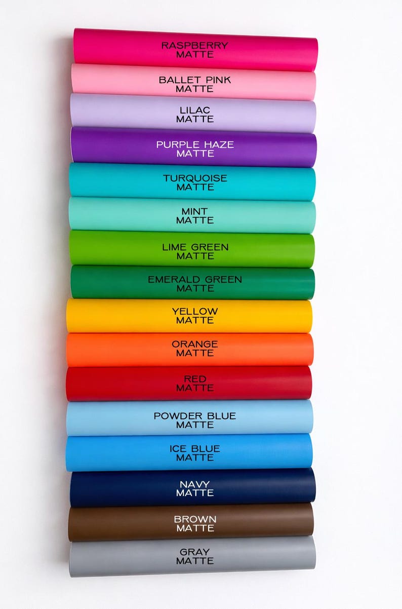 A collection of colorful tubes of matte paint arranged in a row, each tube labeled with a different color.