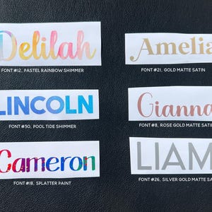 six different names written in various fonts, including pastel rainbow shimmer, gold matte satin, splatter paint, font #32, font #26, and font #8.