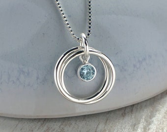 Birthstone necklace handmade from sterling silver with two interlocking rings