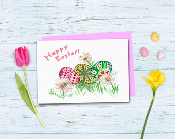 May include: A white card with the words "Happy Easter!" written in pink. Three colorful Easter eggs are drawn on the card, surrounded by white flowers and green grass.