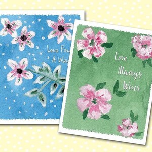 May include: Two watercolor greeting cards with pink flowers and green leaves on a blue and green background. The text on the cards reads "Love Finds A Way" and "Love Always Wins".