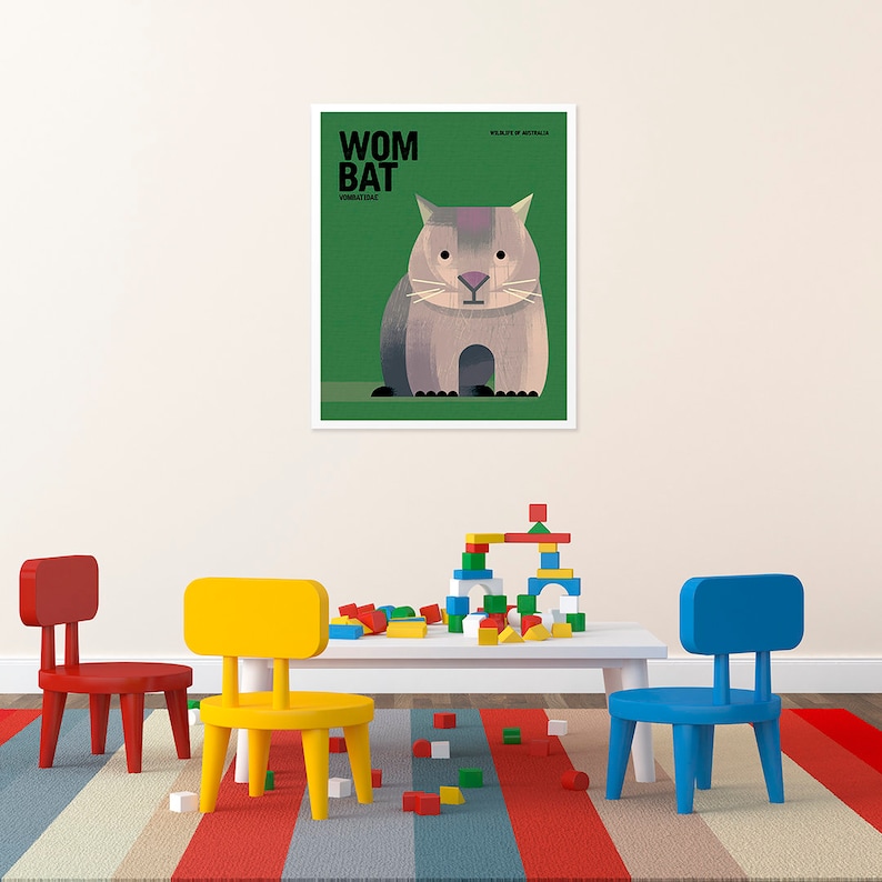May include: A colorful illustration of a wombat, a marsupial native to Australia, with the text "WOMBAT" and "VOMBATIDAE" in black. The illustration is set against a green background.