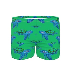 Zwembroek voor heren.  Swooshend schildpadontwerp van Juliet Turnbull. OP BESTELLING GEMAAKT