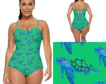 Retro full coverage swimming costume. Swooshing turtles art print design on blue art swimsuit by Juliet Turnbull. MADE TO ORDER