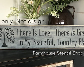 May include: A gray wooden sign with a black silhouette of a weeping willow tree and the text "There Is Love, There Is Grace, In My Peaceful, Country Place". The sign is labeled "Farmhouse Stencil Shoppe".
