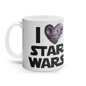 May include: White ceramic coffee mug with a black graphic that says "I love Star Wars" with a Death Star shaped like a heart.